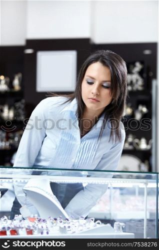 The attractive girl considers a show-window