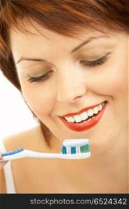 The attractive woman is going to clean a teeth of a tooth-brush . Hygiene