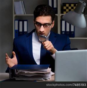The auditor looking for errors in financial reporting for company. Auditor looking for errors in financial reporting for company