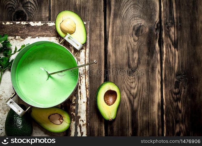 The avocado sauce. On a rustic background.. The avocado sauce. On rustic background.