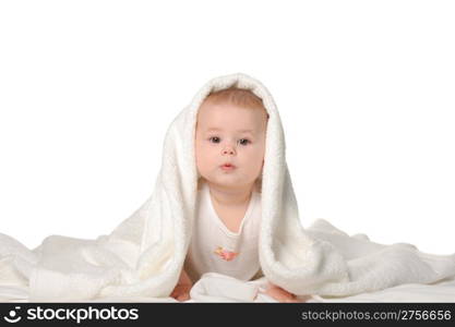 The baby under a towel. Age of 8 months. It is isolated on a white background