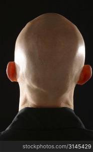 The Back of a bald man&acute;s head.