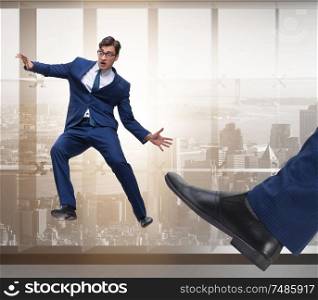 The bad angry boss kicking employee in business concept. Bad angry boss kicking employee in business concept