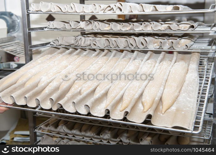 the baker prepares bread dough