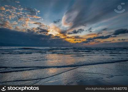 The Baltic sea coastline, sunset. The last day light near Baltic sea. Selective focus, long exposure.