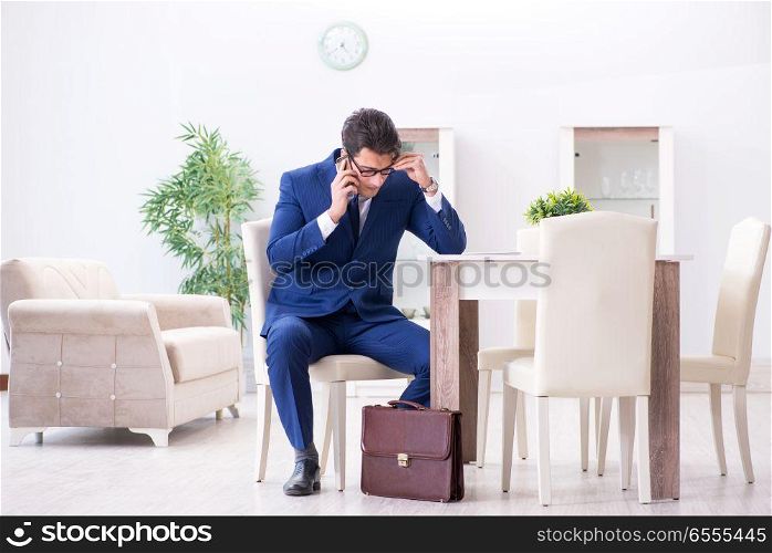 The bankrupt businessman angry and upset at home. Bankrupt businessman angry and upset at home. The bankrupt businessman angry and upset at home