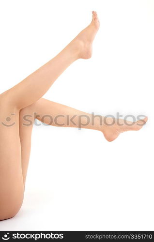 The barefooted female feet lifted upwards sideways, isolated