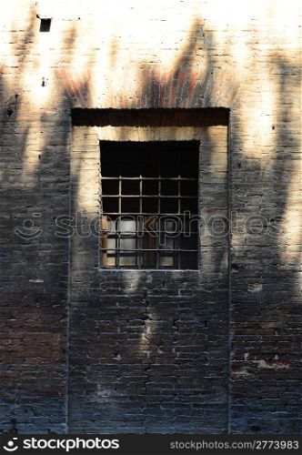 The Barred Window of the Old Jail in Italy
