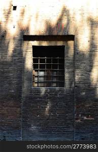 The Barred Window of the Old Jail in Italy
