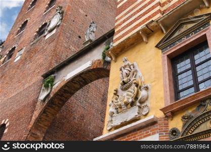 The bas-reliefs and statues on buildings in Piazza della Signoria in Verona, Italy