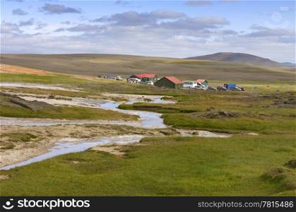 The base camp near the geothermal hot spring area in the remote highlands of the Kjolur region in Iceland.