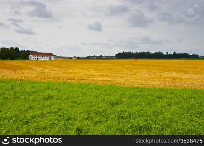 The Bavarian Village Surrounded By Mown Fields
