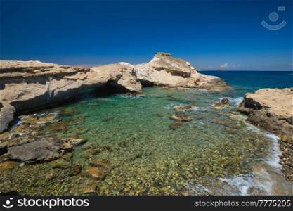 The beach of Agios Konstantinos with crystal clear turquoise water and rock formations in Milos island, Greece. The beach of Agios Konstantinos in Milos, Greece