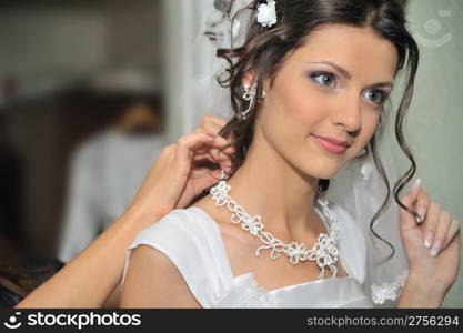 The beautiful bride. The young girl in a wedding dress.