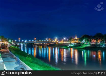 The beautiful color of the lights on Road pathway in the park for relaxing walking jogging or ride bicycle and exercise at night in Phitsanulok City, Thailand.