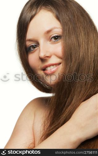 The beautiful girl with long healthy hair. It is isolated on a white background