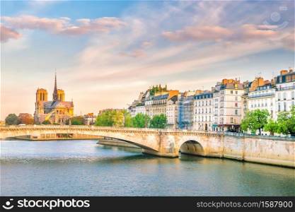 The beautiful Notre Dame de Paris and Seine River at twilight