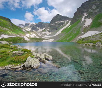 The beautiful summer landscape of Caucasus mountain. Dukka lakes near Arkhyz village in Russia. Daylight mountain landscape.