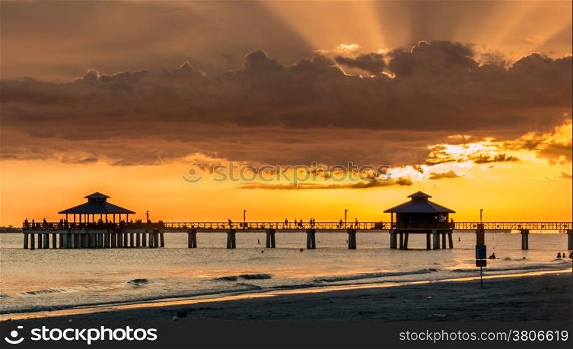 The beautiful sun setting on the shores of Fort Myers Beach located on Estero Island in Florida, United States of America