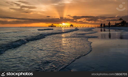 The beautiful sun setting on the shores of Fort Myers Beach located on Estero Island in Florida, United States of America