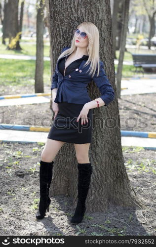 the beautiful woman at a tree in park