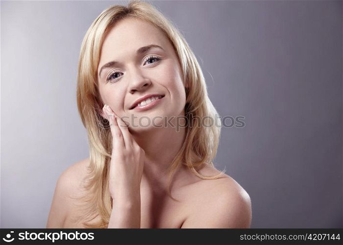 The beautiful woman with a hand isolated