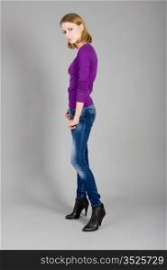 The beautiful young girl in jeans and a blouse