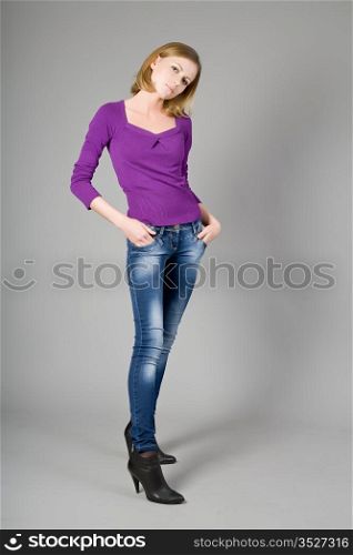 The beautiful young girl in jeans and a blouse