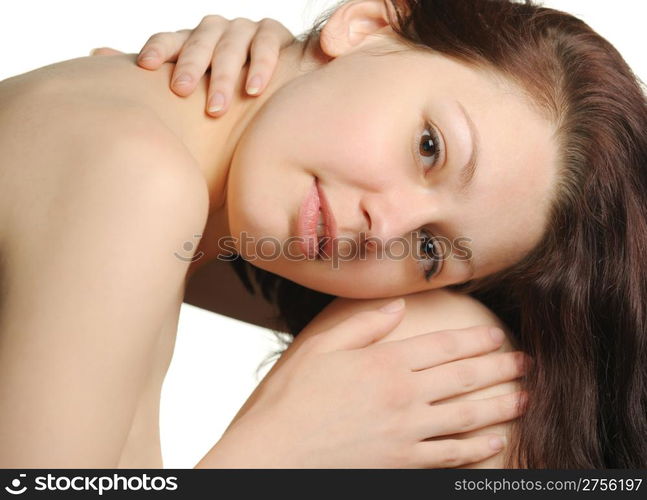 The beautiful young woman embracing hands. Natural beauty. It is isolated on a white background