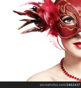 The beautiful young woman in a red mysterious venetian mask