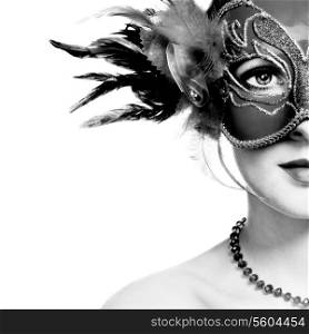 The beautiful young woman in mysterious venetian mask. Black and white photo