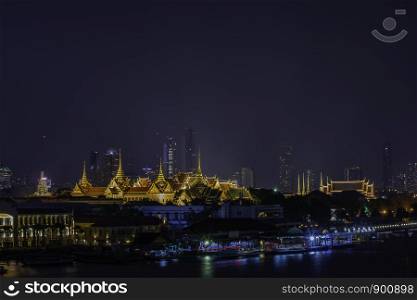 The beauty of the Golden palaces and phra keaw Temple ,The Chao Phraya River at night in Bangkok, Thailand.