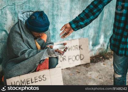The beggars sit on the side of the road and have money.