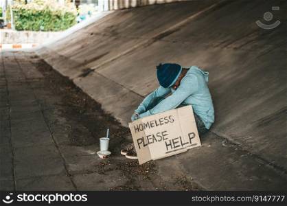 The beggars sit under the bridge with a homeless message. Please help.