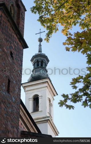 The bell tower of the ancient cathedral in Sandomierz in the sky