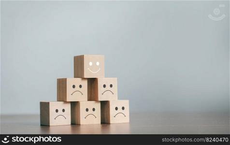 The best business services rate the customer experience. sorted by service level Satisfaction Survey Concept With a business wooden block, choose a smiley face on the top wooden block.