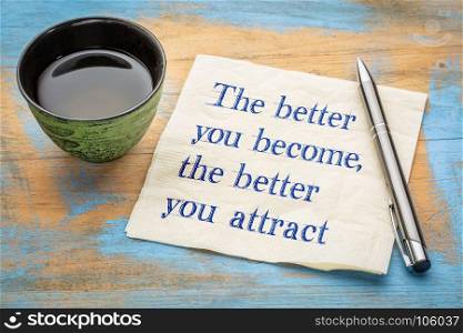 The better you become, the better you attract, law of attraction concept - handwriting on a napkin with a cup of tea