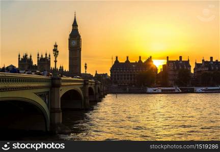 The Big Ben, the Houses of Parliament and Westminster bridge in London in a beautiful summer night, England, United Kingdom