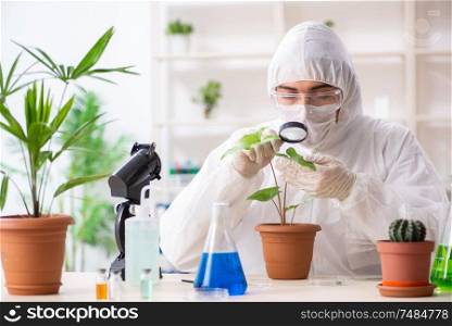 The biotechnology chemist working in lab. Biotechnology chemist working in lab