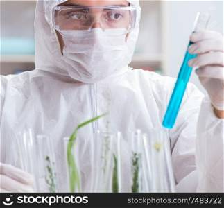 The biotechnology scientist chemist working in lab. Biotechnology scientist chemist working in lab