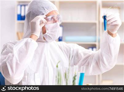 The biotechnology scientist chemist working in lab. Biotechnology scientist chemist working in lab