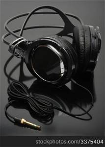 The black headphones on a black background