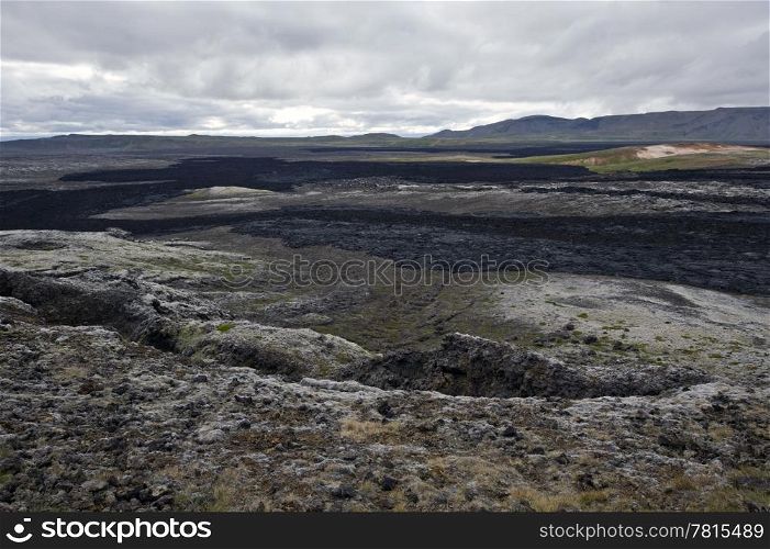 The black lava streams, resulting from the 1984 eruption of the Krafla Volcanic System in Iceland is still warm, and provides the proof of the forces of nature