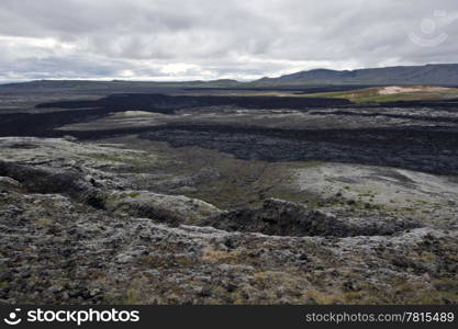 The black lava streams, resulting from the 1984 eruption of the Krafla Volcanic System in Iceland is still warm, and provides the proof of the forces of nature