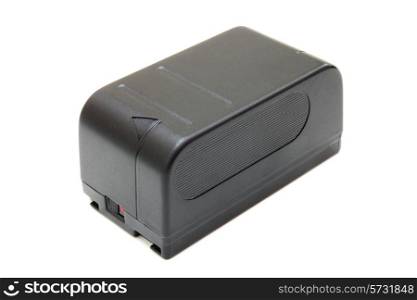 The black small rectangular accumulator from a videocamera on a white background
