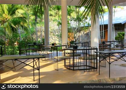 the black steel outdoor living set install at outdoor lobby in resort