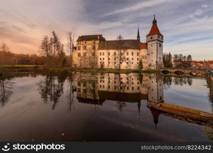 The Blatna water castle in the autumn sunset in the South Bohemian region is one of the best-preserved water manors in the Czech Republic.