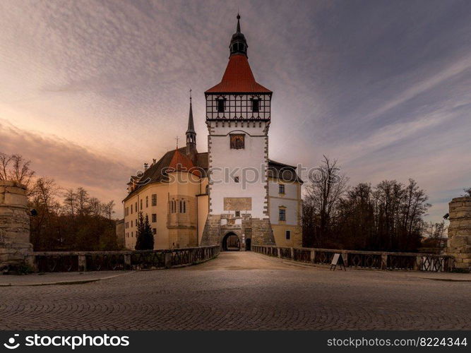 The Blatna water castle in the autumn sunset in the South Bohemian region is one of the best-preserved water manors in the Czech Republic.