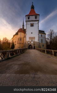 The Blatna water castle in the autumn sunset in the South Bohemian region is one of the best-preserved water manors in the Czech Republic.