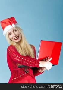 The blonde in a New Year&acute;s hat and with the red laptop